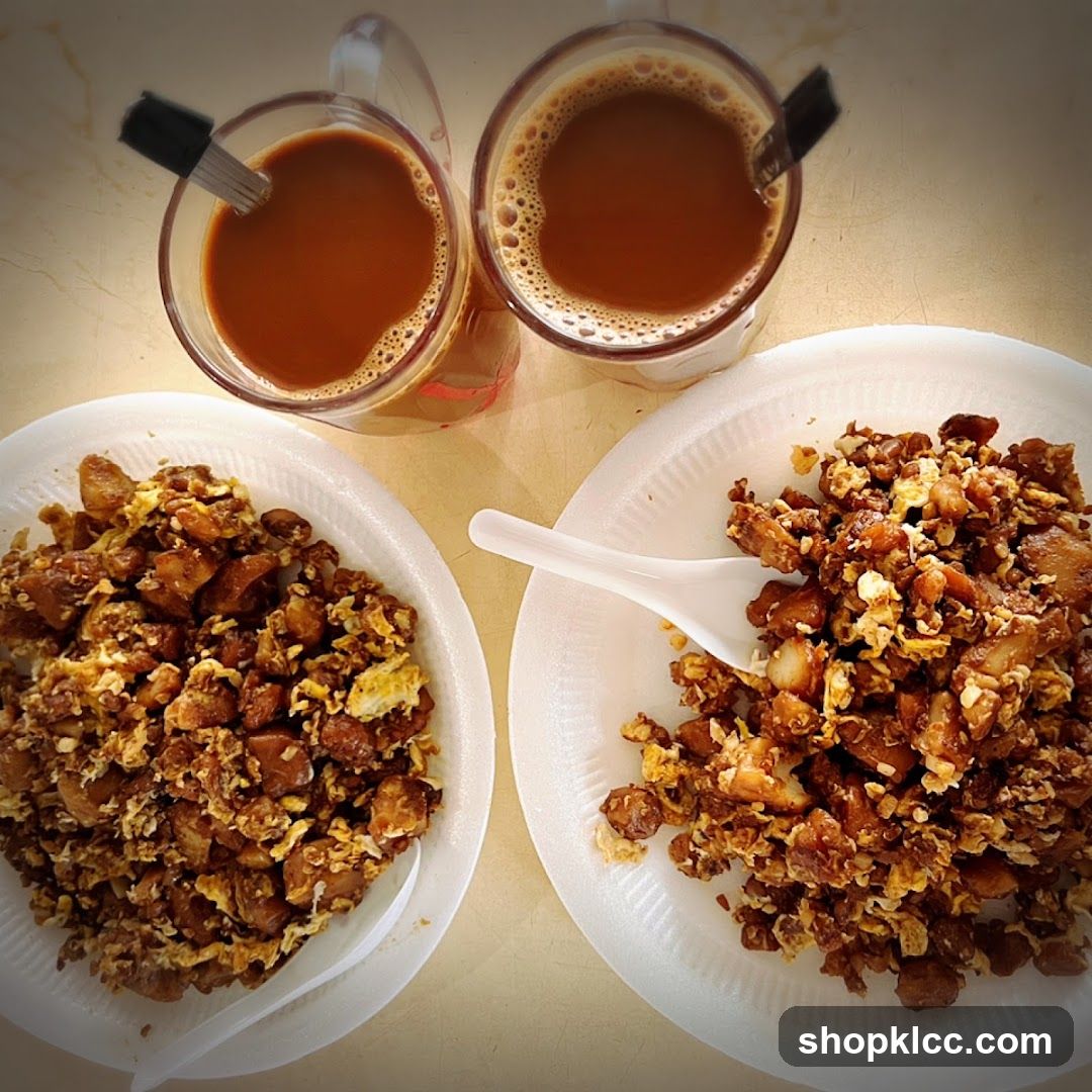 Two plates of fried radish cake with two cups of coffee