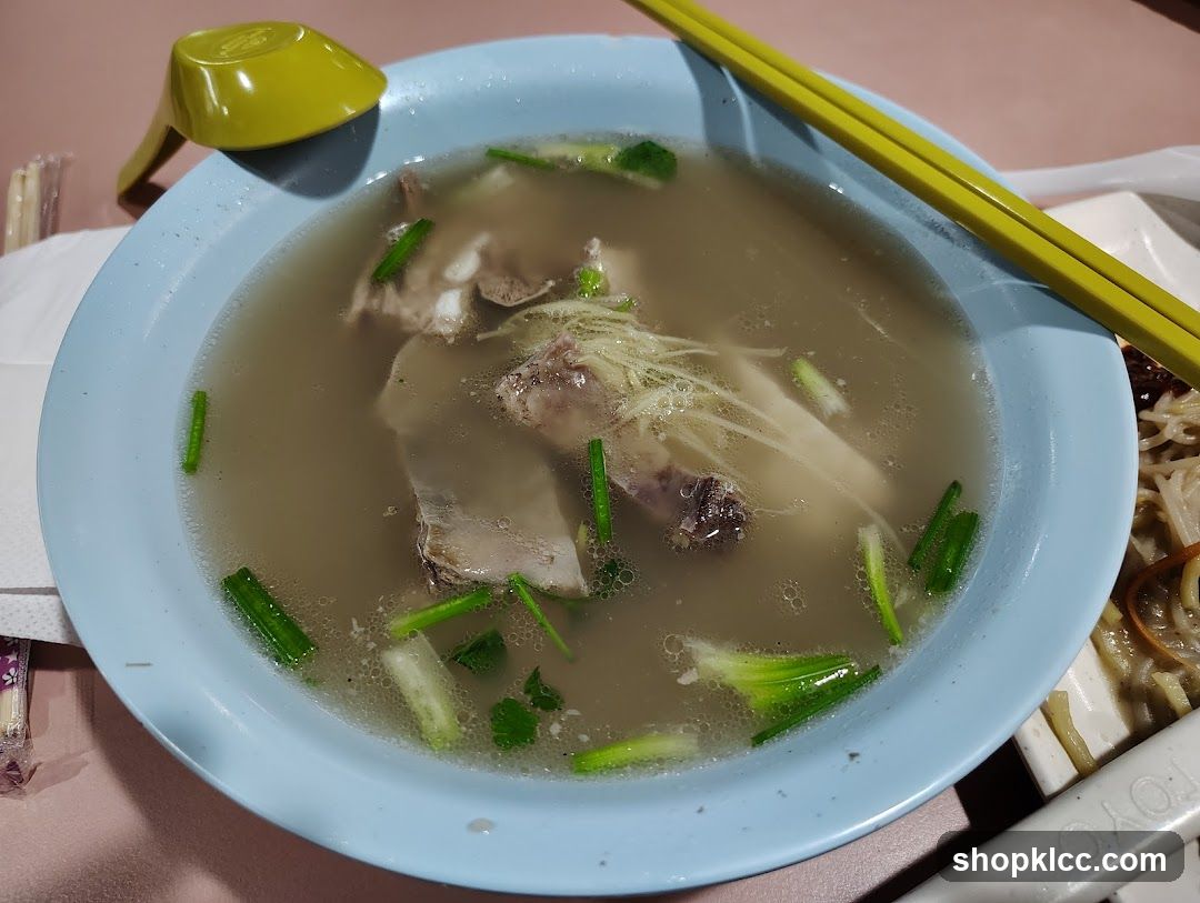 Bowl of Soup with Meat and Noodles