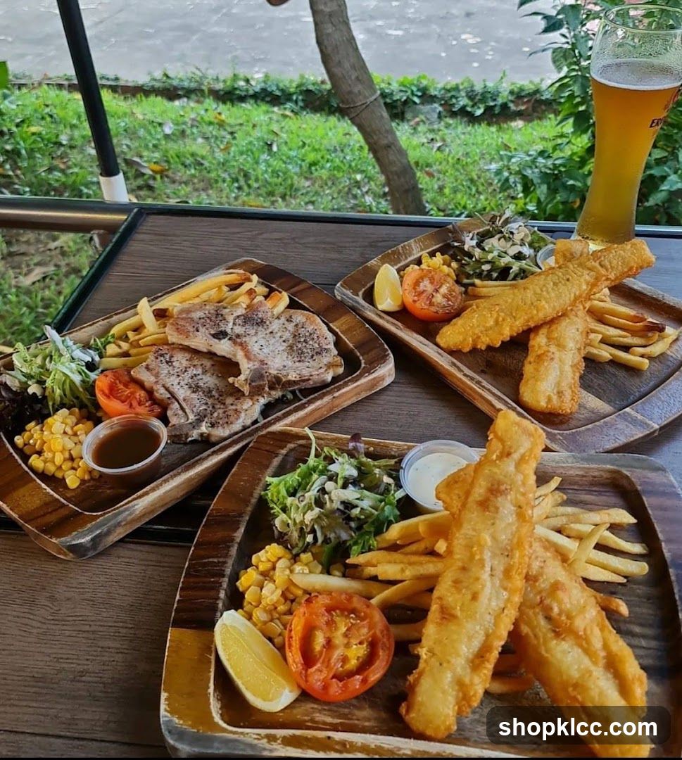 Three Wooden Platters of Food with a Beer