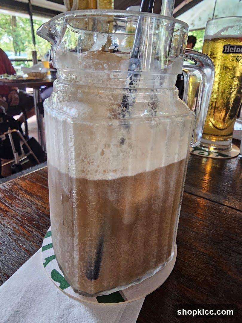 Pitcher of Iced Coffee with Beer in Background