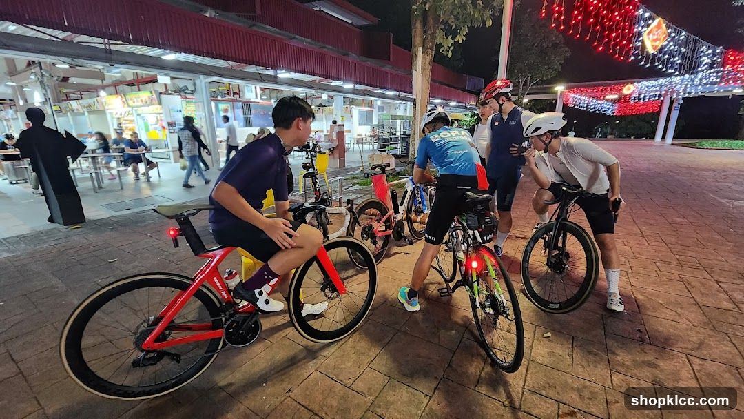 Cyclists gathered at a food court
