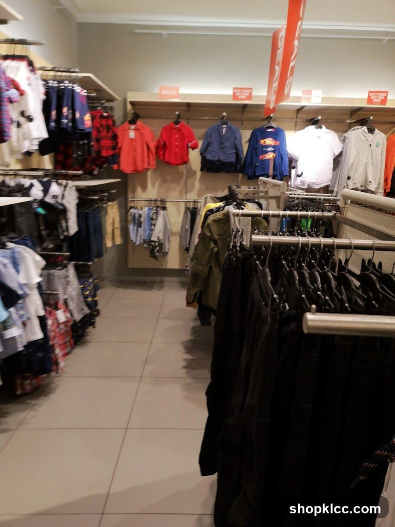 Clothing store aisle with sale signs