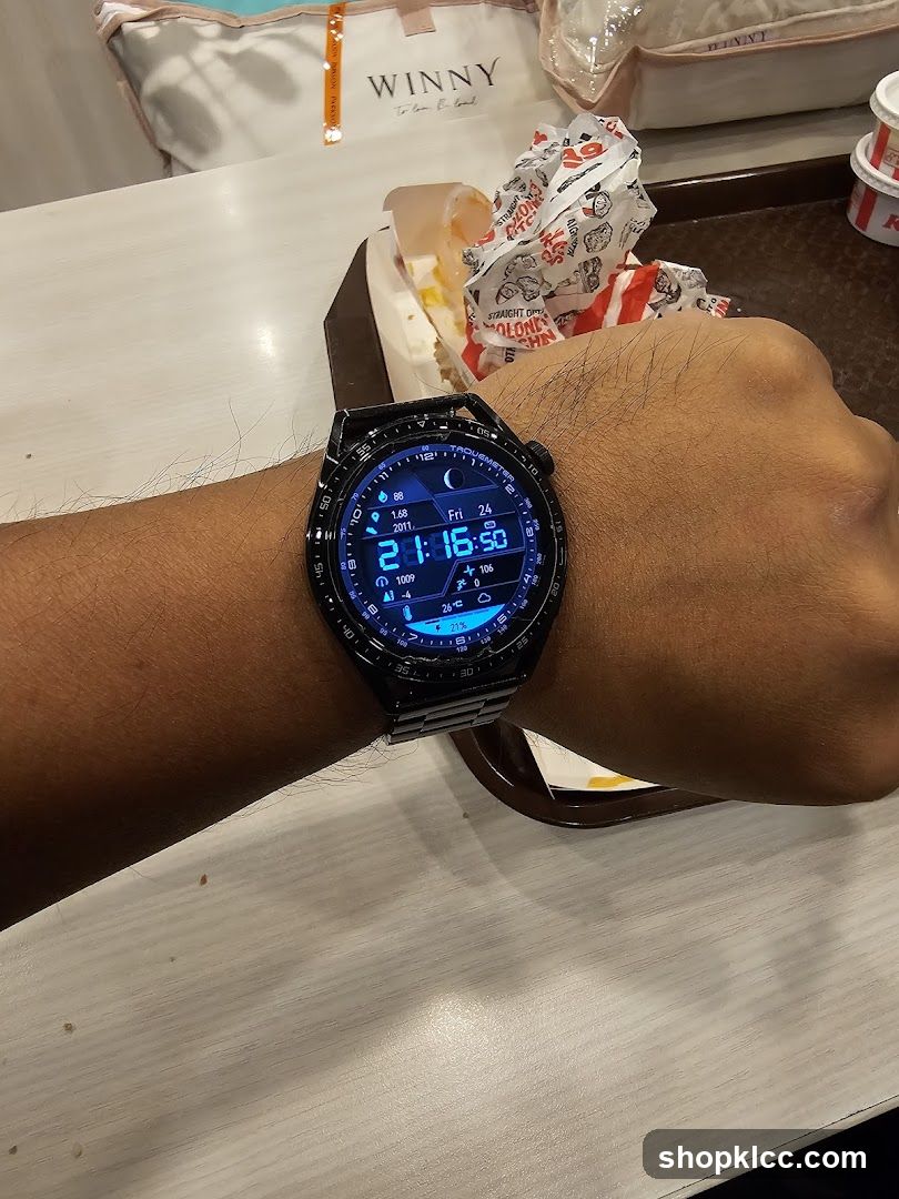Hand wearing smartwatch at dining table