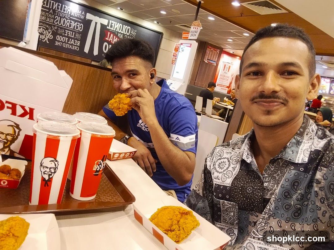 Two men dining at KFC