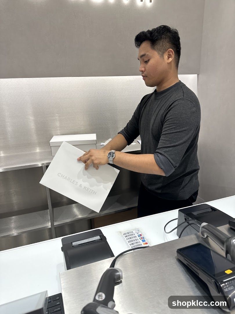 Employee holding a shopping bag