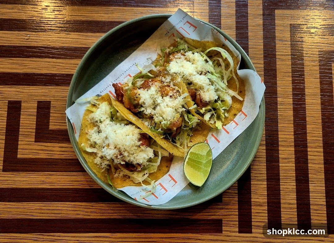 Three Tacos with Lime Wedge