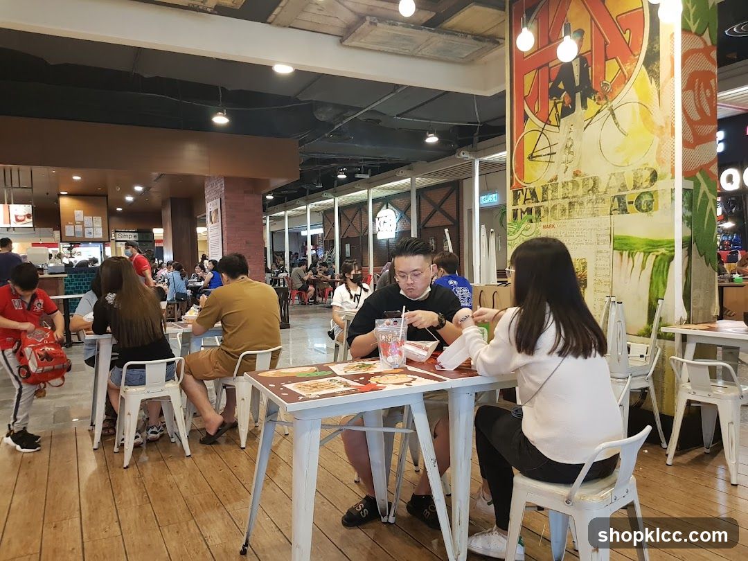 People eating at tables in a food court