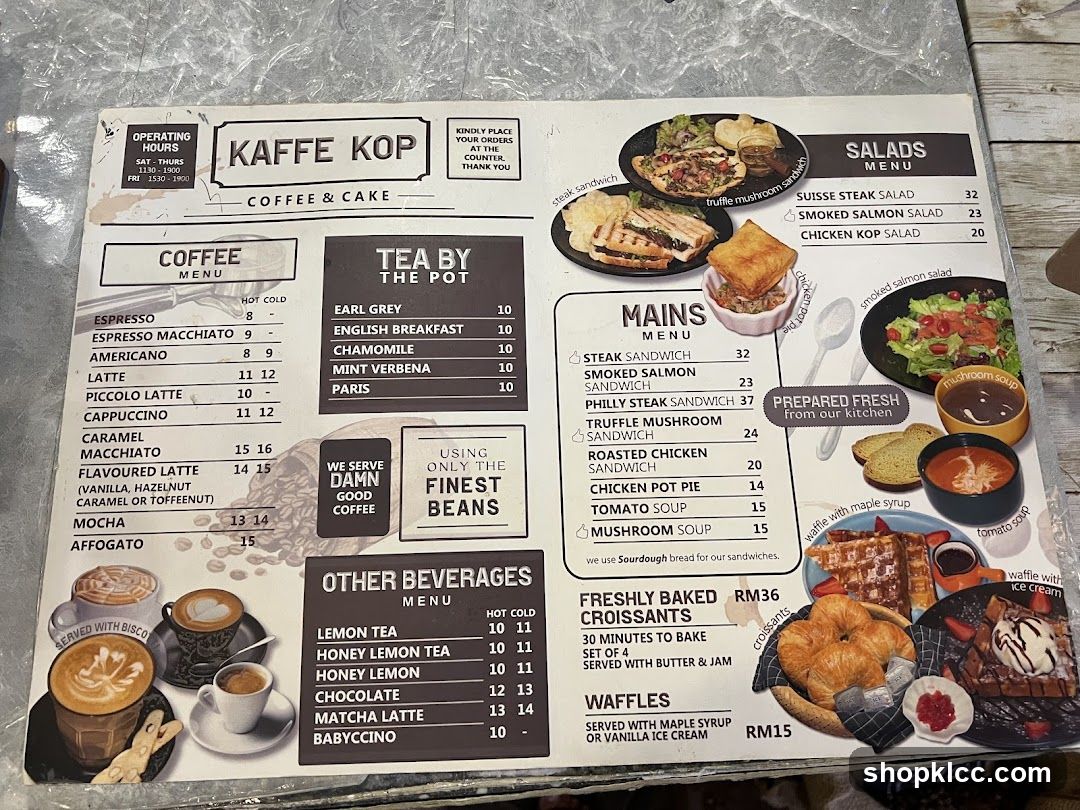 A menu for Kaffe Kop, offering coffee, tea, mains, salads, freshly baked croissants, and waffles.