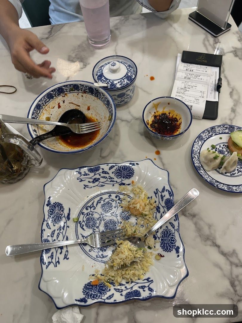Table with leftover food and receipt
