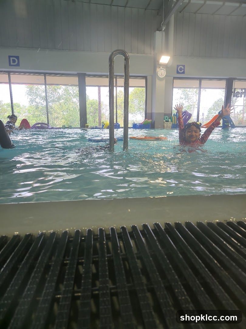 Children enjoying a swimming pool
