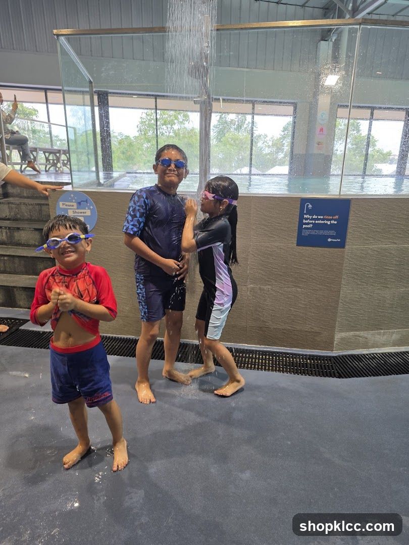 Children showering before entering pool