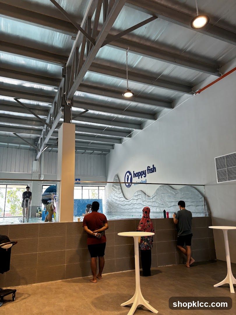 Indoor swimming pool area with seating