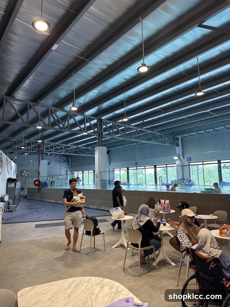 Indoor swimming pool area with seating