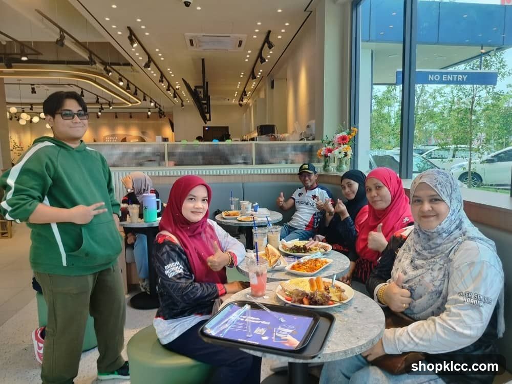 Group enjoying a meal at a cafe