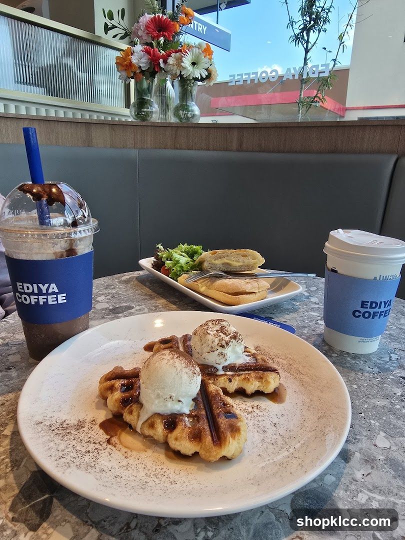 Coffee shop table with waffles and drinks