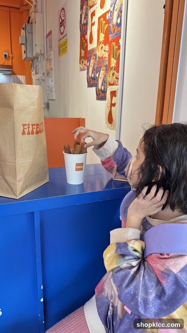 Child reaching for churros