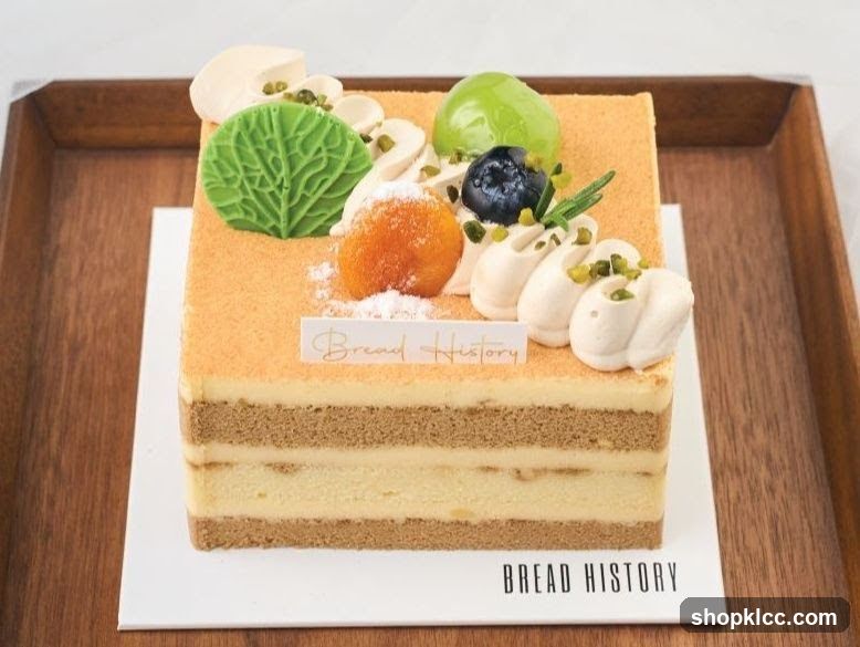 Square cake with fruit and cream decoration