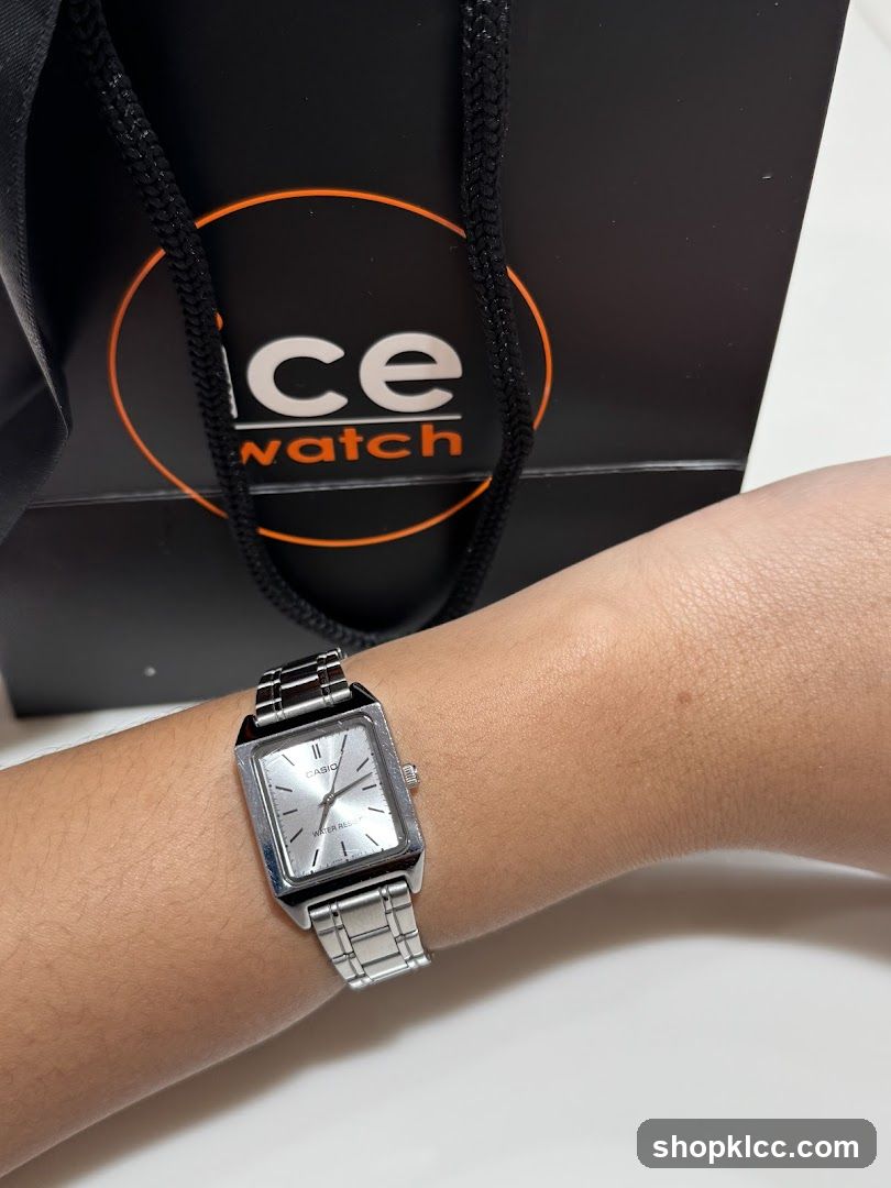 Watch on wrist with shopping bag