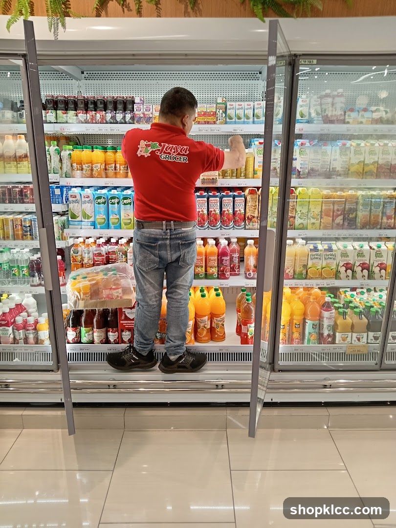 Employee stocking shelves in a grocery store