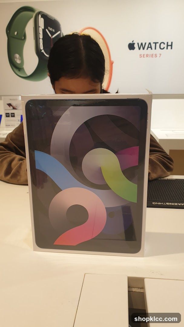 Person holding an iPad box