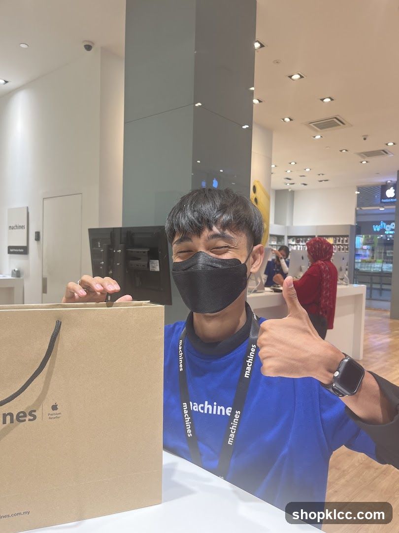 Man giving a thumbs up in a store