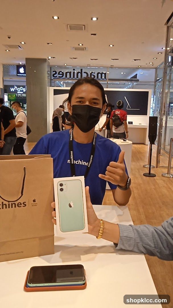 Salesperson holding an iPhone box