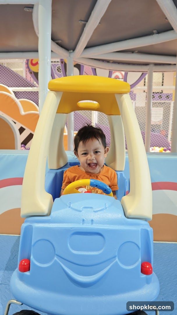Child in Toy Car