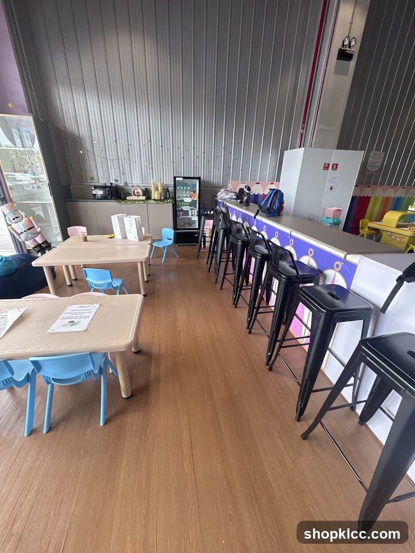 Indoor seating area with tables and bar stools