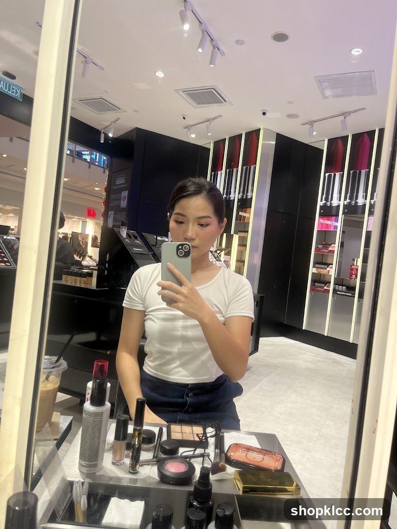 Woman Taking Selfie in Makeup Store