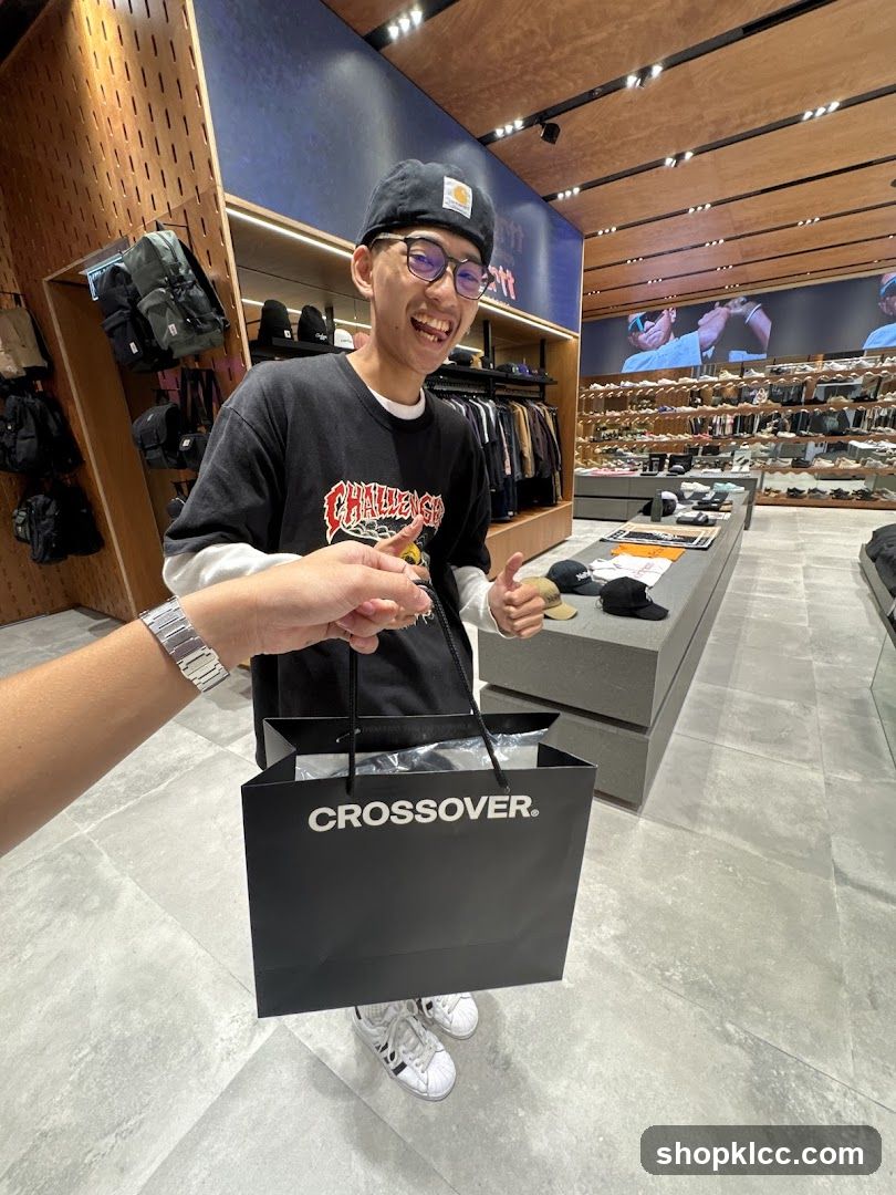 Man holding a shopping bag in a store