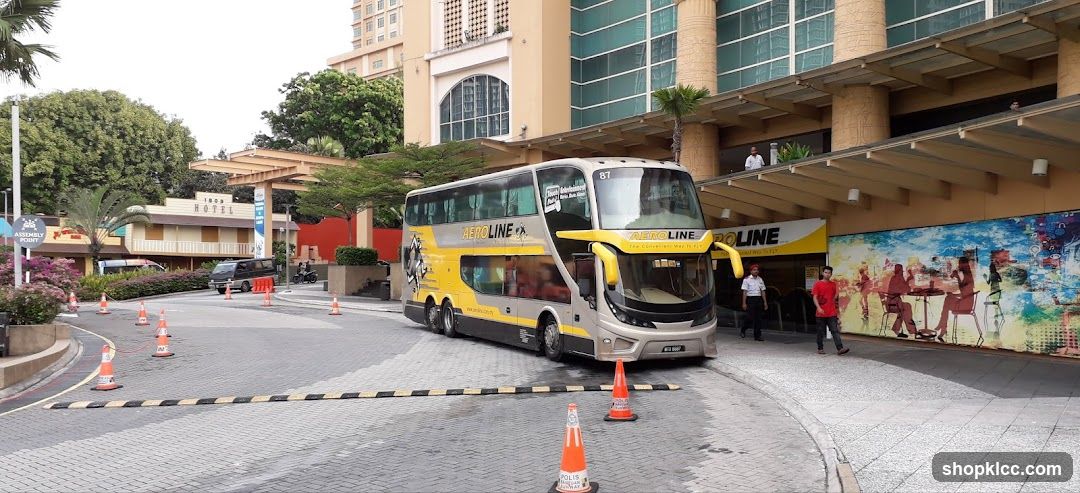 Double-decker bus at hotel entrance