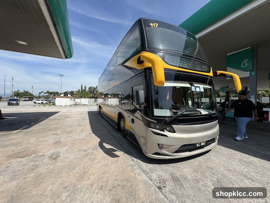 Double-decker bus at a gas station