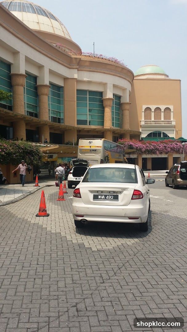 Cars and Bus at Building Entrance