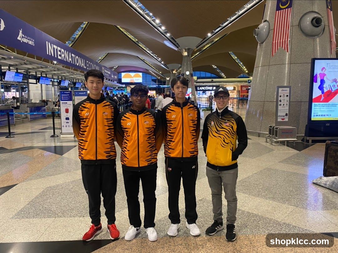 Four young men in athletic wear