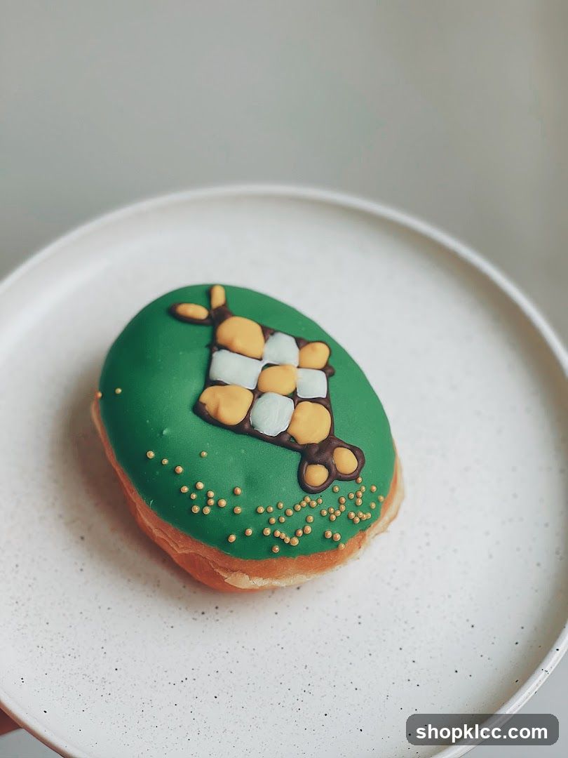 Donut with green icing and checkered pattern