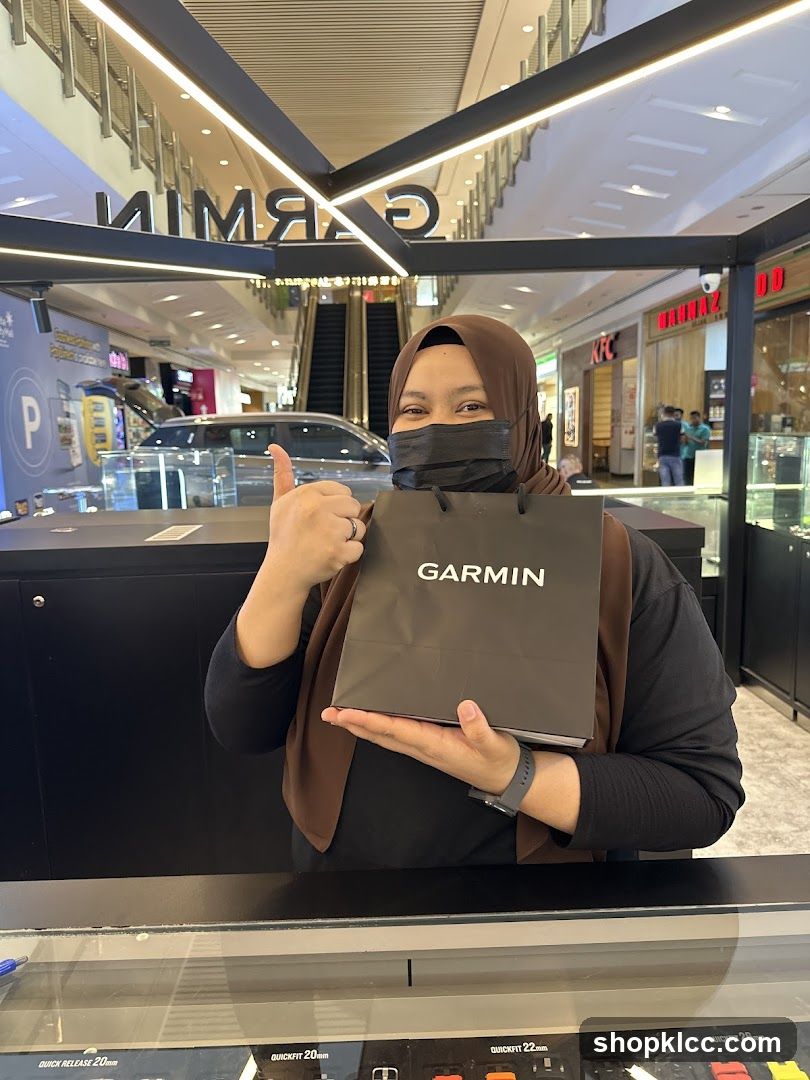 Woman holding a Garmin shopping bag