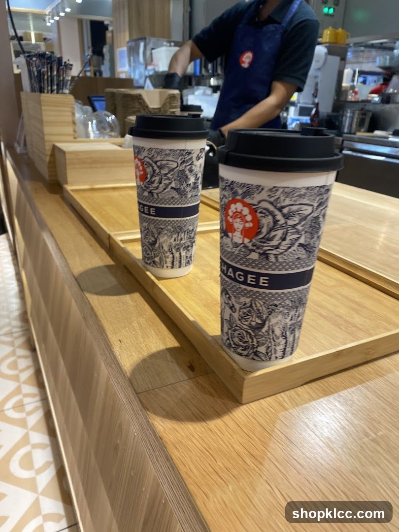 Two coffee cups on a wooden counter