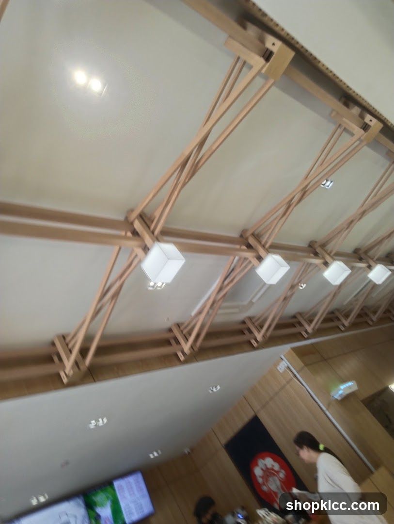 Interior of a building with wooden beams and lights