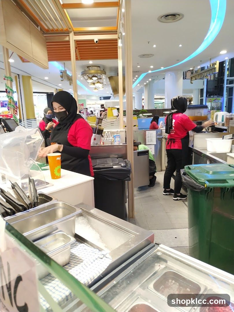 Food stall workers preparing orders