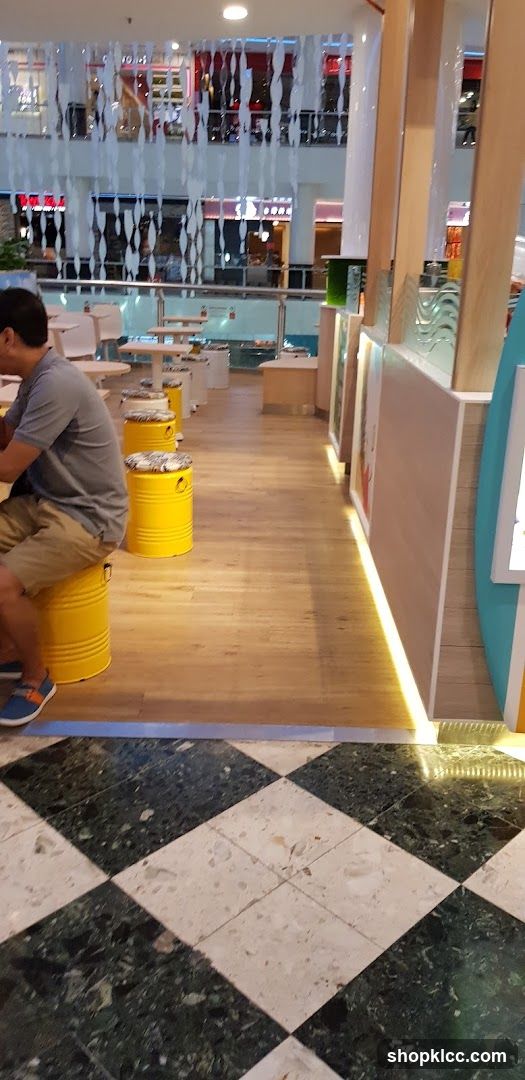 Indoor seating area with yellow stools
