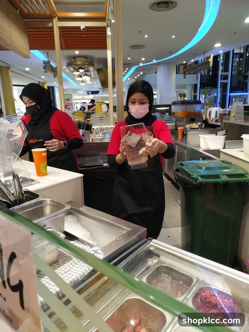 Juice Bar Staff Preparing Drinks