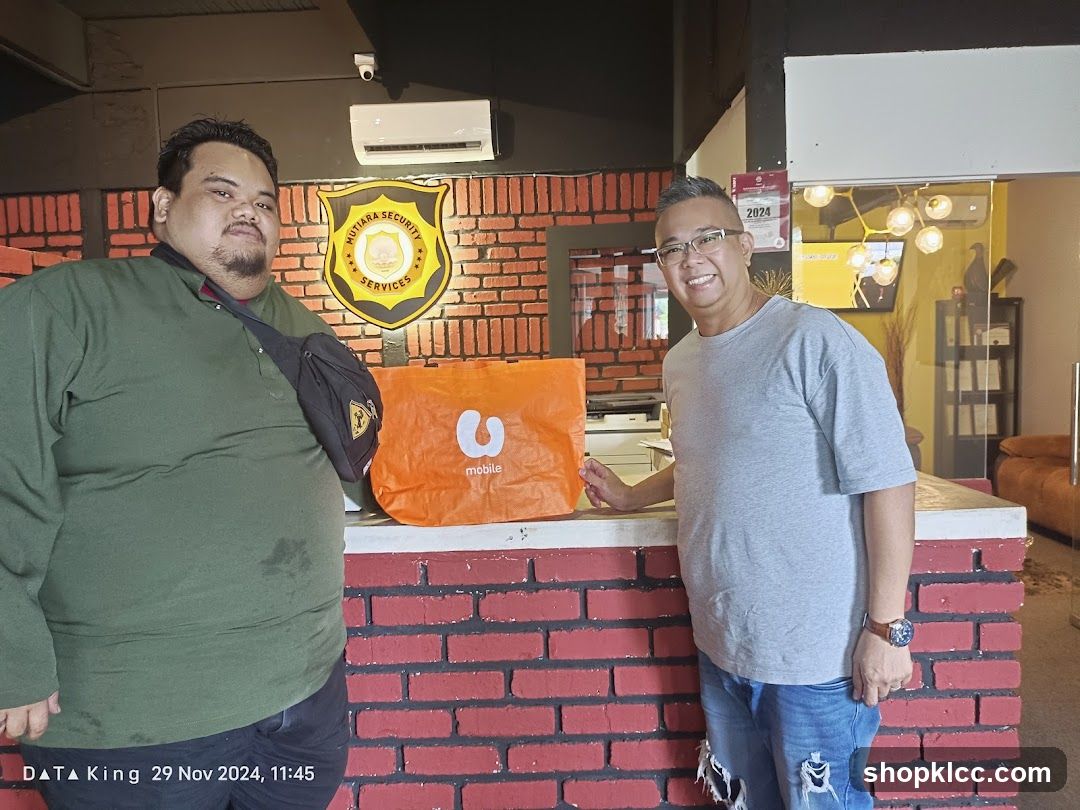 Two men with a shopping bag
