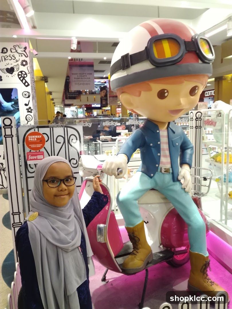 Child Poses With Cartoon Character Display