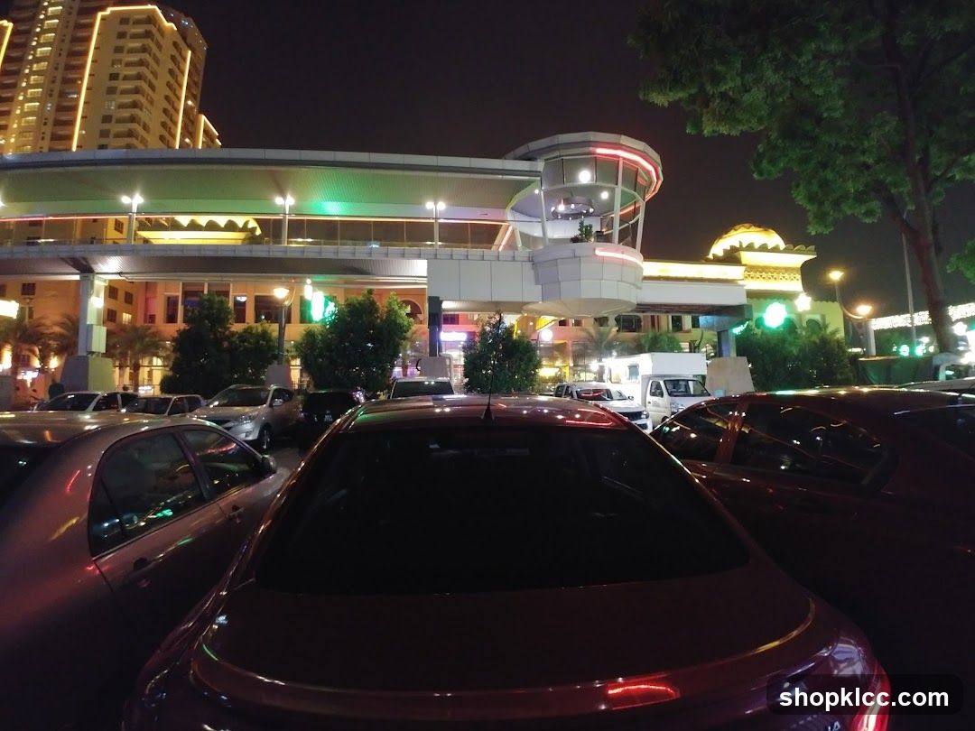 Nighttime view of a shopping complex parking lot