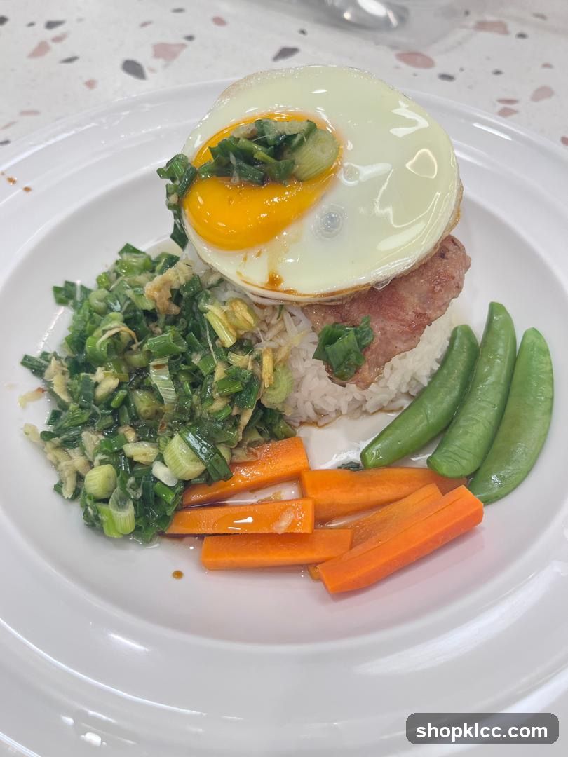 Rice dish with fried egg and vegetables