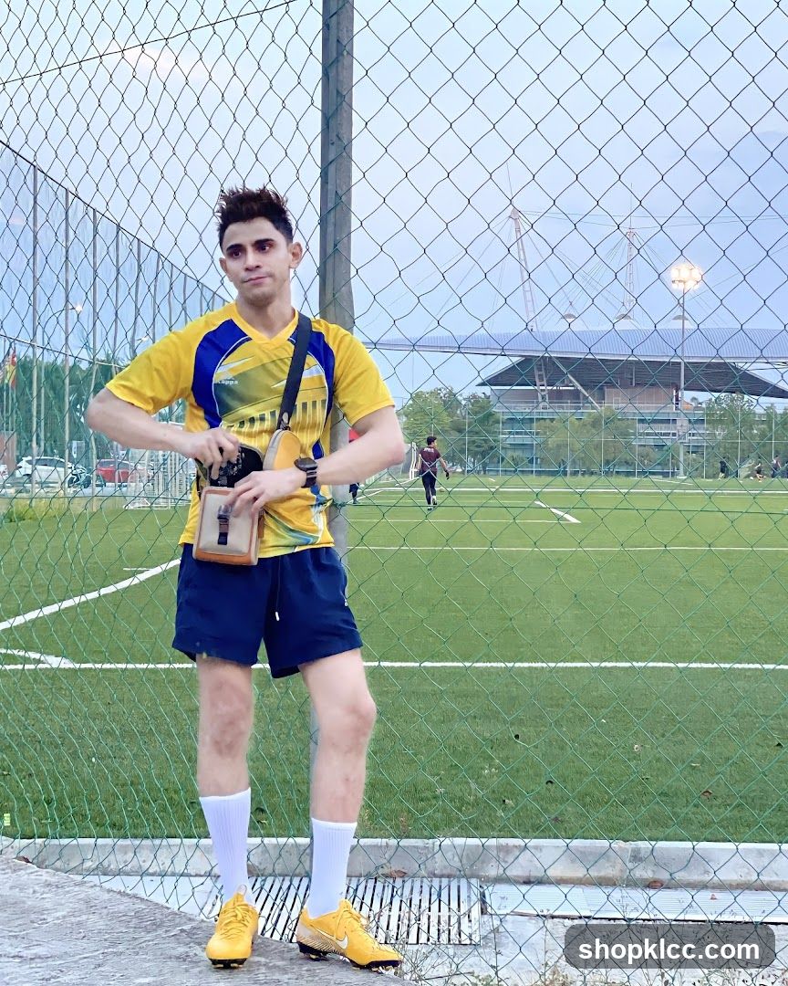 Man in Yellow Jersey at Soccer Field