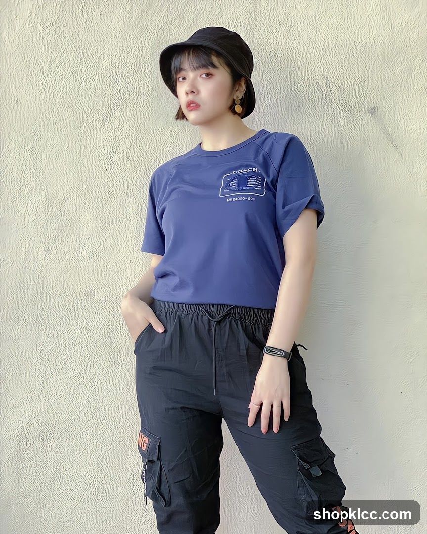 Woman in Blue T-shirt and Black Cargo Pants