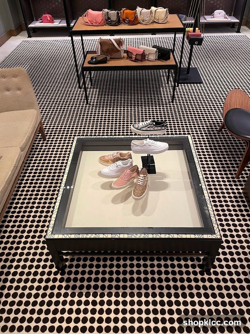 Coach Store Interior with Handbags and Sneakers