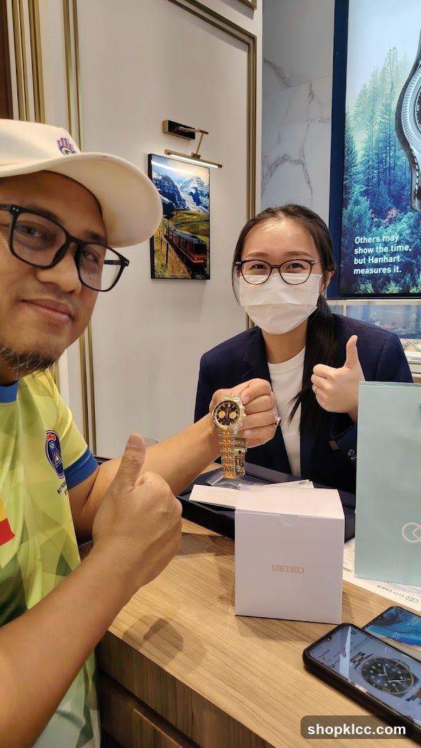 Customer and Salesperson with Watch