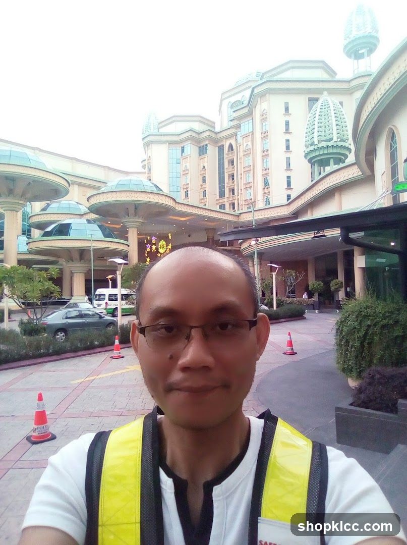 Man in front of a large building